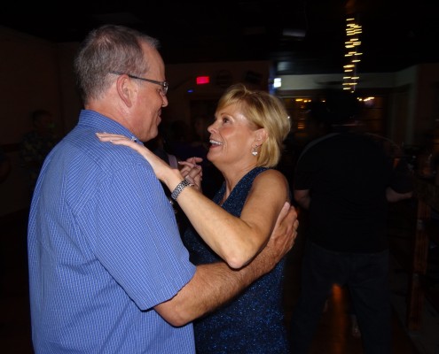 happy couple ballroom dancing