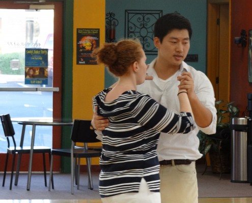 Teacher and student dancing