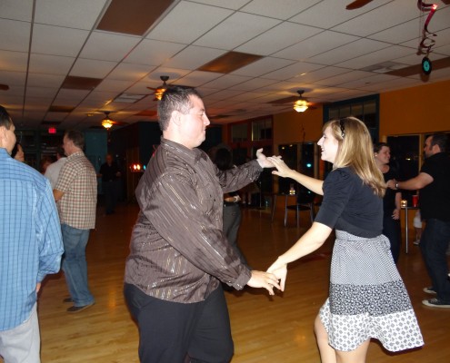 a couple swing dancing