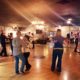 A group of people dancing in a studio